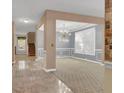 A cozy, open-concept living room features large windows, elegant wainscoting, and contemporary lighting at 267 Windy Cir, Mcdonough, GA 30253