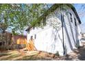 Side view of a charming two-story home with a walkout deck and freshly painted white exterior at 3959 Emerald Springs Ct, Decatur, GA 30035