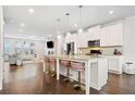 Open concept kitchen with white cabinets, a large island, and stainless steel appliances at 4344 Colorado Fir Aly, Doraville, GA 30360