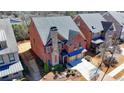 Aerial view of a brick home with a stone chimney and landscaped yard in a residential neighborhood at 4892 Kentwood Dr, Marietta, GA 30068