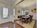 Elegant dining room featuring hardwood floors, a fireplace, and a wooden table with seating for eight at 4892 Kentwood Dr, Marietta, GA 30068