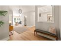 Welcoming entryway featuring hardwood floors, bench seating, and a decorative mirror at 1208 Thomas Rd, Decatur, GA 30030