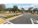 Well-manicured community entrance featuring an American flag, welcoming residents and visitors at 4415 Natchez Ln, Cumming, GA 30040
