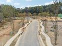 An aerial view of a road that shows a sidewalk going through the property at 4415 Natchez Ln, Cumming, GA 30040