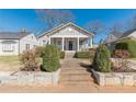 Beautiful single-story house offering a classic front porch and landscaped front yard at 1763 Mercer Ave, Atlanta, GA 30337