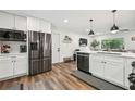 Bright kitchen featuring stainless steel appliances, white cabinets, and open design at 3314 Creatwood Se Trl, Smyrna, GA 30080