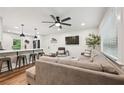 Open concept living room and kitchen featuring modern finishes and ample seating at 3314 Creatwood Se Trl, Smyrna, GA 30080