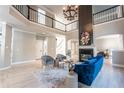 Spacious living room with a fireplace, high ceilings, and elegant decor at 6045 Standard View Dr, Johns Creek, GA 30097