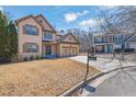 Inviting home with two-car garage, green lawn and traditional design at 6640 Grove Crossing Ct, Cumming, GA 30028