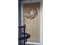 A decorative wreath hangs on the front door, welcoming visitors to this charming home at 1352 Orchard Park Dr, Stone Mountain, GA 30083