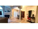 Open-concept living area features a fireplace, dining area, and plenty of natural light at 1352 Orchard Park Dr, Stone Mountain, GA 30083
