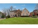 Charming two-story home with manicured lawn, elegant windows and a well-maintained landscape at 551 Straton Chase Se, Marietta, GA 30067
