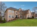 Lovely two-story home with arched windows, lush lawn, and well-kept landscaping at 551 Straton Chase Se, Marietta, GA 30067