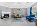 Inviting living room with neutral walls, fireplace, and an abundance of natural light at 5099 Leeshire Trce, Tucker, GA 30084