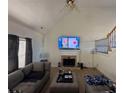 Comfortable living room featuring wood flooring, a fireplace and neutral colors at 1208 Lauren Nw Ct, Acworth, GA 30101