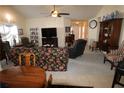 Spacious living room with carpet, tile and a ceiling fan at 709 Jacoby Dr, Loganville, GA 30052