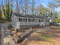 A quaint single-story home featuring a covered front porch and classic architectural design at 2790 Collier Nw Dr, Atlanta, GA 30318