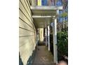 Covered walkway showing the side of the home with natural surroundings at 3015 Camden Way, Alpharetta, GA 30005