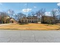 Traditional two-story home with symmetrical facade, shutters, and a well-maintained lawn at 3215 Northbrook Dr, Atlanta, GA 30341