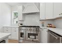 Modern kitchen with stainless steel appliances, white cabinetry, and elegant countertops at 240 Mount Zion Rd, Hapeville, GA 30354