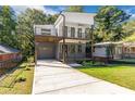 Modern two-story home features a gray and white exterior and a two-story balcony at 1464 Ezra Church Nw Dr, Atlanta, GA 30314