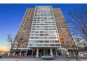 Large high-rise condo building featuring many windows and a covered entry way at 215 Piedmont Ne Ave # 1608, Atlanta, GA 30308