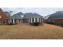 Spacious backyard featuring a well-maintained lawn and a cozy patio area at 2604 Harman Park Cir, Duluth, GA 30097
