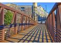View of the bridge with a wooden walkway overlooking the beautiful apartments at 260 18Th Nw St # 10302, Atlanta, GA 30363
