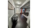 Inviting entryway with hardwood floors, elegant decor, and views into the dining room at 5215 Tye Trl, Fairburn, GA 30213