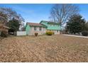 Charming home with a neatly maintained lawn, beautiful landscaping, and mature trees at 6100 Prestige Valley Rd, Morrow, GA 30260