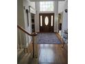 Inviting foyer with a striking front door, high ceiling, and elegant hardwood floors at 1470 Sweet Bottom Sw Cir, Marietta, GA 30064