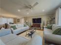 Bright living room with neutral furniture, recessed lighting, and large windows at 1894 Dogwood Ct, Snellville, GA 30078