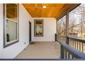 Inviting front porch with gray railings, offering a welcoming entrance at 3192 Highway 411 Ne, White, GA 30184
