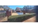 Community pool area with gated entrance and lush landscaping at 3307 York Pl, Decatur, GA 30032