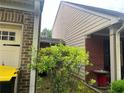 View of the property's exterior showing the brick and siding, with well-maintained landscaping at 312 Lauren Dr, Fairburn, GA 30213