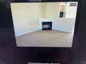 Inviting living room with a fireplace and a view into the kitchen at 312 Lauren Dr, Fairburn, GA 30213