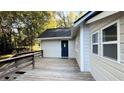 A deck leads to a blue back door on the home's exterior at 8083 Highway 166, Douglasville, GA 30135