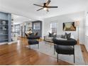Bright living room with hardwood floors, modern furnishings, and open-concept design to the kitchen at 1636 Stanwood Se Ave, Atlanta, GA 30317