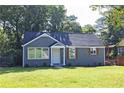 A charming home with a well-manicured lawn and freshly painted exterior, offering great curb appeal at 672 Quillian Ave, Decatur, GA 30032