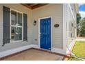 Close-up of the inviting blue front door with sidelight and address plaque at 140 Ryan Ln, Covington, GA 30014