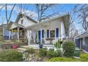 Quaint cottage-style home with a charming front porch and inviting curb appeal at 818 Virgil Ne St, Atlanta, GA 30307