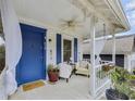 Inviting front porch with comfortable seating, blue door, and decorative details at 818 Virgil Ne St, Atlanta, GA 30307