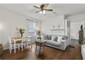 Comfortable living room with hardwood floors, sofa, and a decorative fireplace mantle at 818 Virgil Ne St, Atlanta, GA 30307