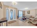 Inviting foyer with stylish door, soft lighting, and comfortable seating area with neutral tones at 115 Trelawney Cir, Covington, GA 30016