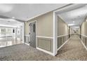 Hallway with neutral color palette and decorative carpet at 1406 River Green Nw Dr, Atlanta, GA 30327