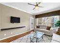 Comfortable living room with plush couches and a large window at 1406 River Green Nw Dr, Atlanta, GA 30327