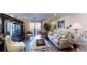 Bright living room with hardwood floors, comfortable seating, and sliding door access to outside at 300 Johnson Ferry Ne Rd # A403, Atlanta, GA 30328