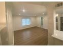 Well-lit living room featuring stylish flooring and neutral décor at 145 Amherst Nw Pl, Atlanta, GA 30327