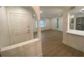 Open-concept living room showcasing new flooring and fresh, neutral paint at 145 Amherst Nw Pl, Atlanta, GA 30327