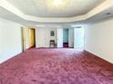 Large finished basement with doors, carpeted floors, and recessed ceiling detail at 5546 Wellborn Creek Dr, Lithonia, GA 30058